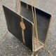 Vintage magazine rack in black leather and gold metal