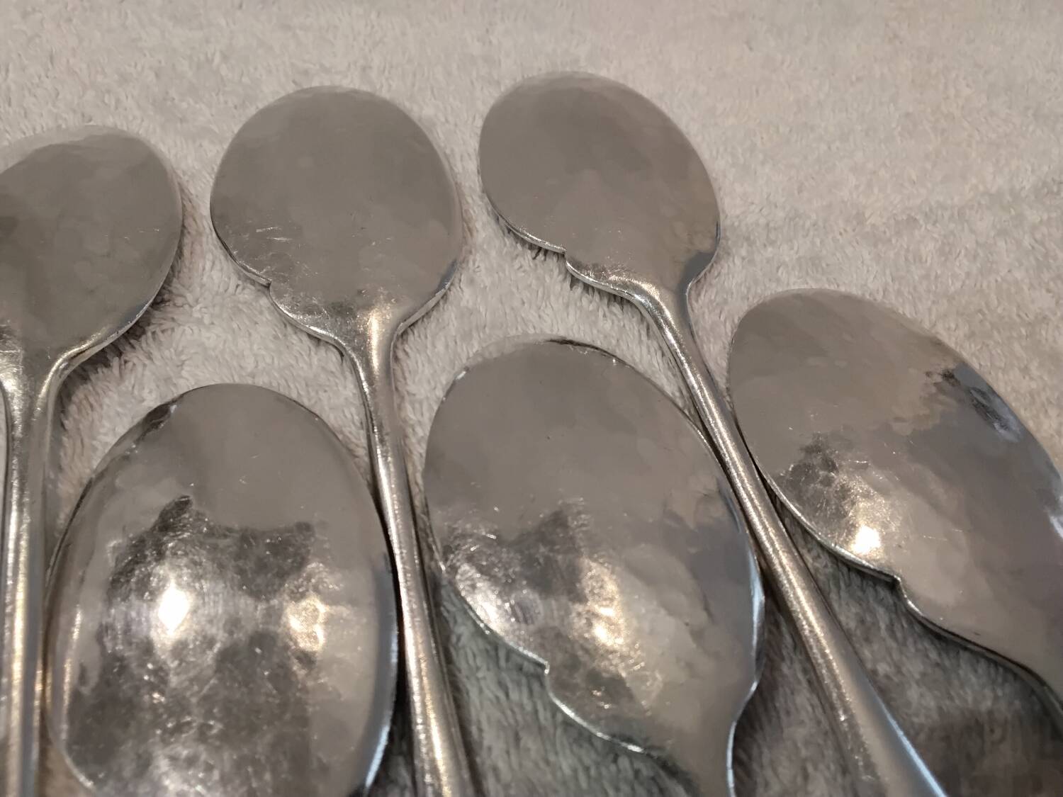 6 individual silver-plated metal sauce spoons with hammered baguette handles