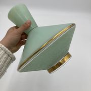 Green and gold saucer suspension