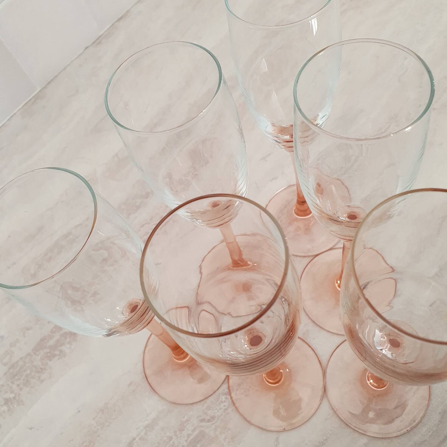 6 champagne flutes with pink stems