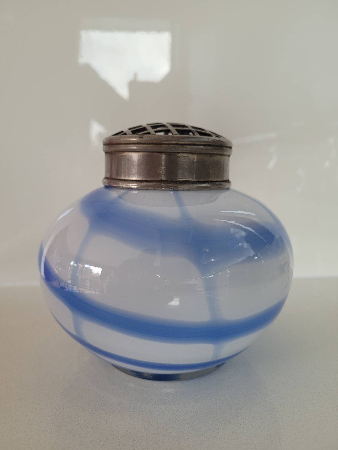 Old white and blue glass flower vase