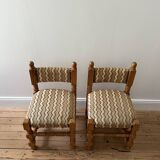 Pair of wooden chairs with herringbone fabric