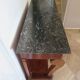 Empire/Restoration style console table with scrolled ends, mirrored back, and claw feet.