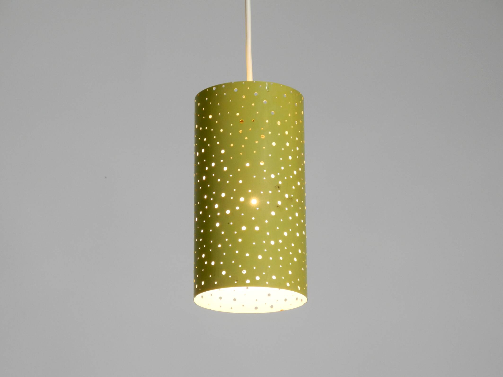 1950s pendant lamp in perforated metal, mustard yellow, by Ernest Igl