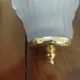 Pair of Art Deco shell wall sconces in frosted glass and brass.