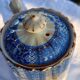 Old coffee service Lunéville with blue lace decoration.