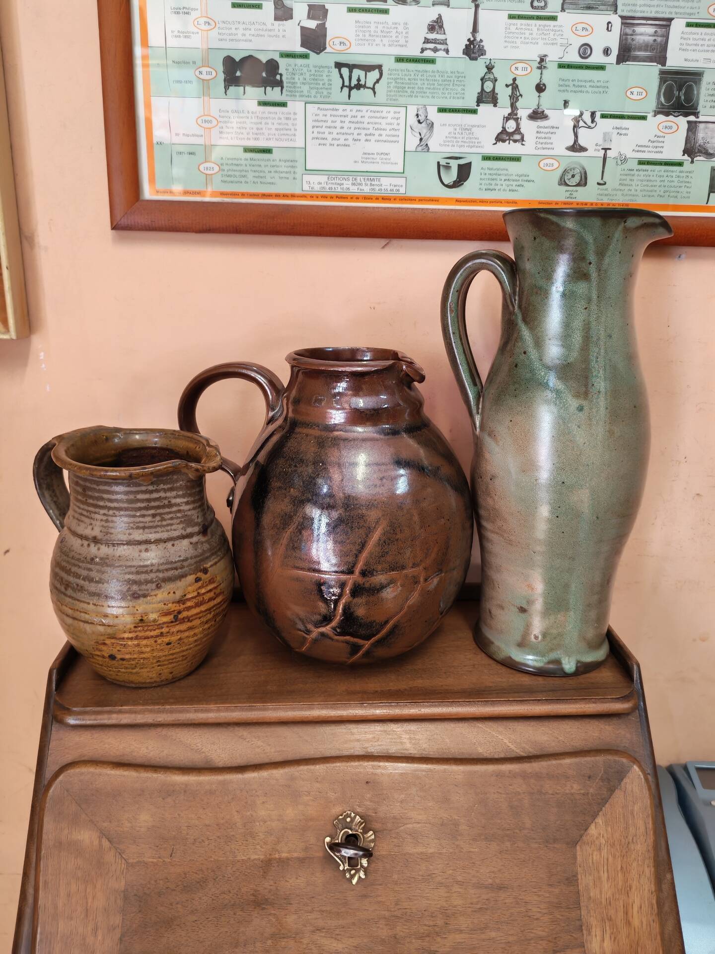 Set of three vintage ceramic jugs and a pitcher.