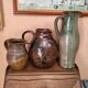 Set of three vintage ceramic jugs and a pitcher.