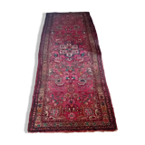 Vintage oriental rug from the 1930s. Handcrafted, handmade. Worn.