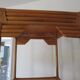 Storage column, wooden bookshelf and woven rattan.
