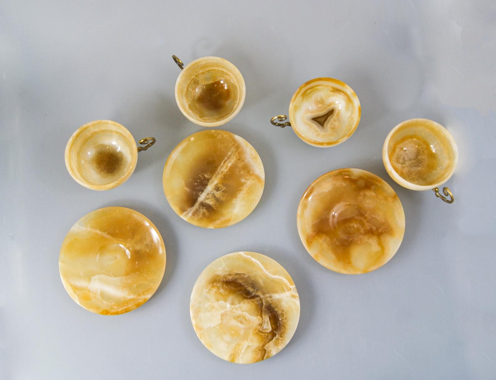 Set of 4 marble and brass espresso cups and saucers