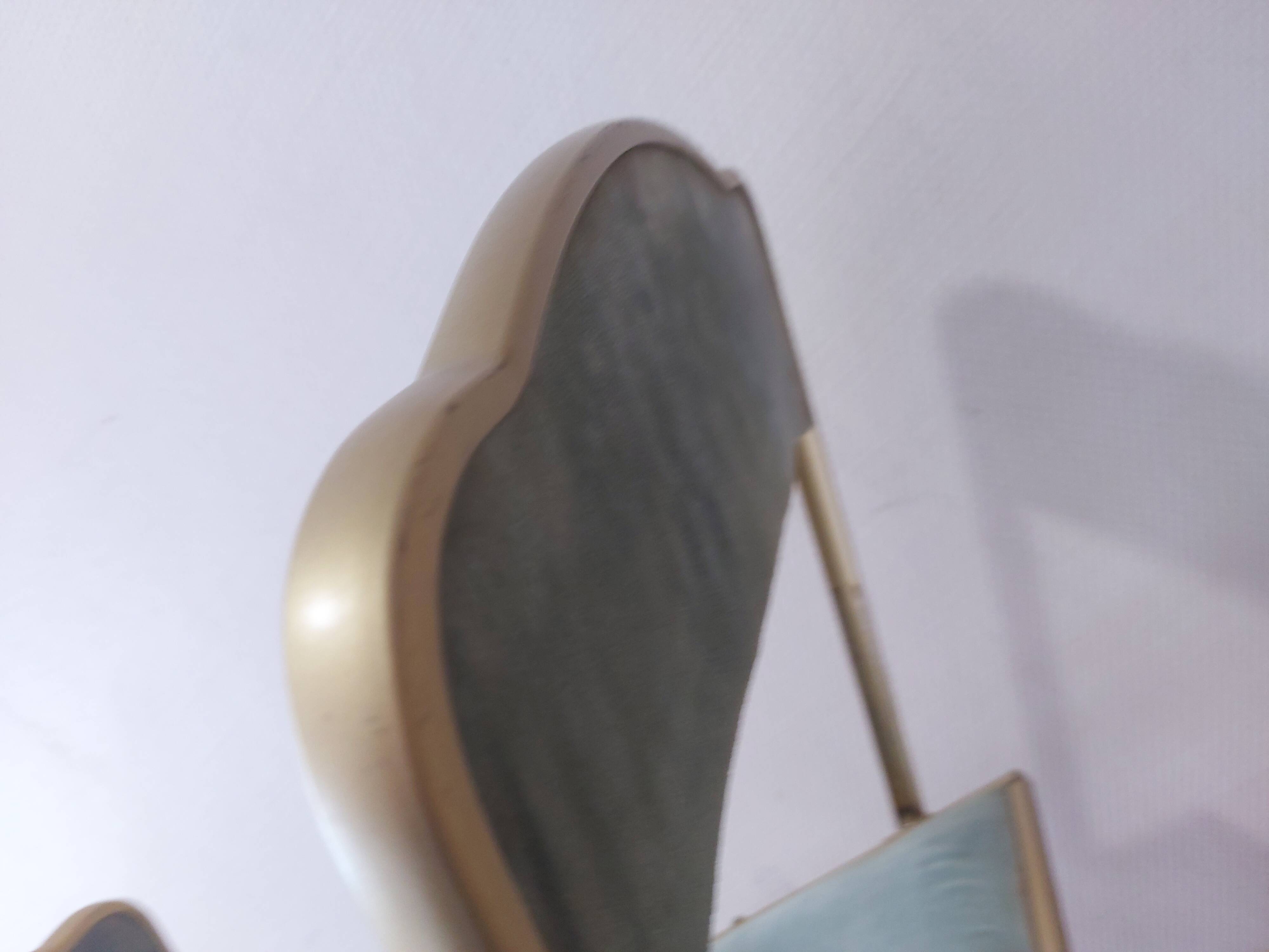 Two folding opera chairs in velvet