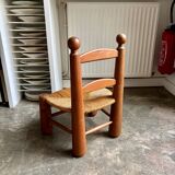 Brutalist low chair in dark wood and straw no. 3