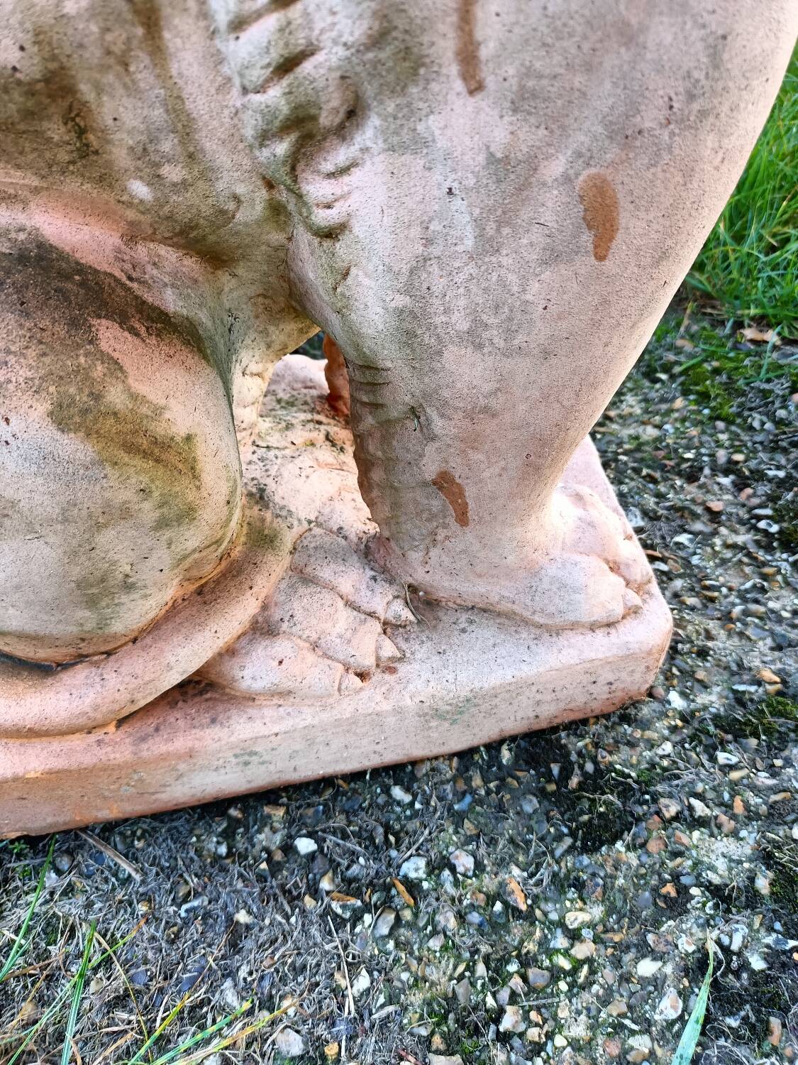 Pair of old terracotta garden lions