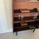 Vintage veneer bookcase with metal legs