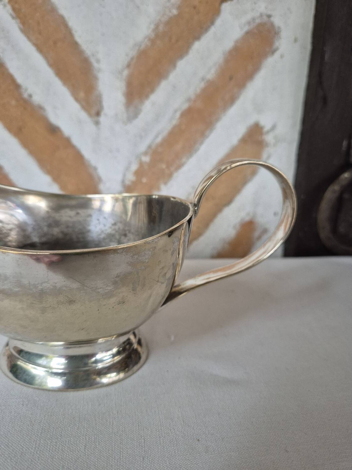 Silver-plated metal gravy boat
