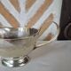 Silver-plated metal gravy boat