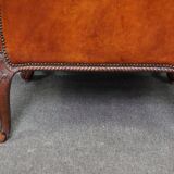 Old armchair in sheep leather