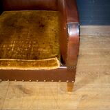 Antique club armchair of leather cloth