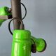 Vintage pendant light with three green spots.