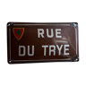 Old enameled street name plate "rue of trye" with its crest