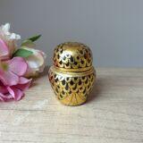 Old small black and gold lacquered wooden box in the shape of an owl