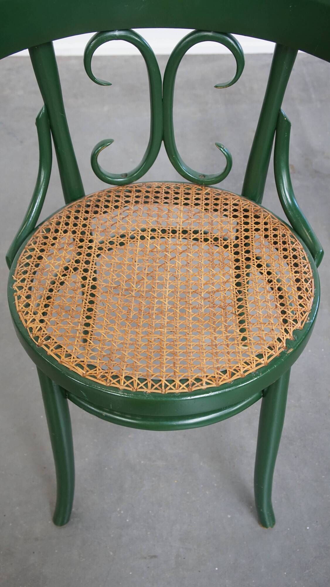 Vintage green bistro chair with woven reed seat