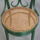 Vintage green bistro chair with woven reed seat