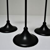 Three Scandinavian black lacquered metal candle holders