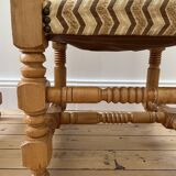 Pair of wooden chairs with herringbone fabric