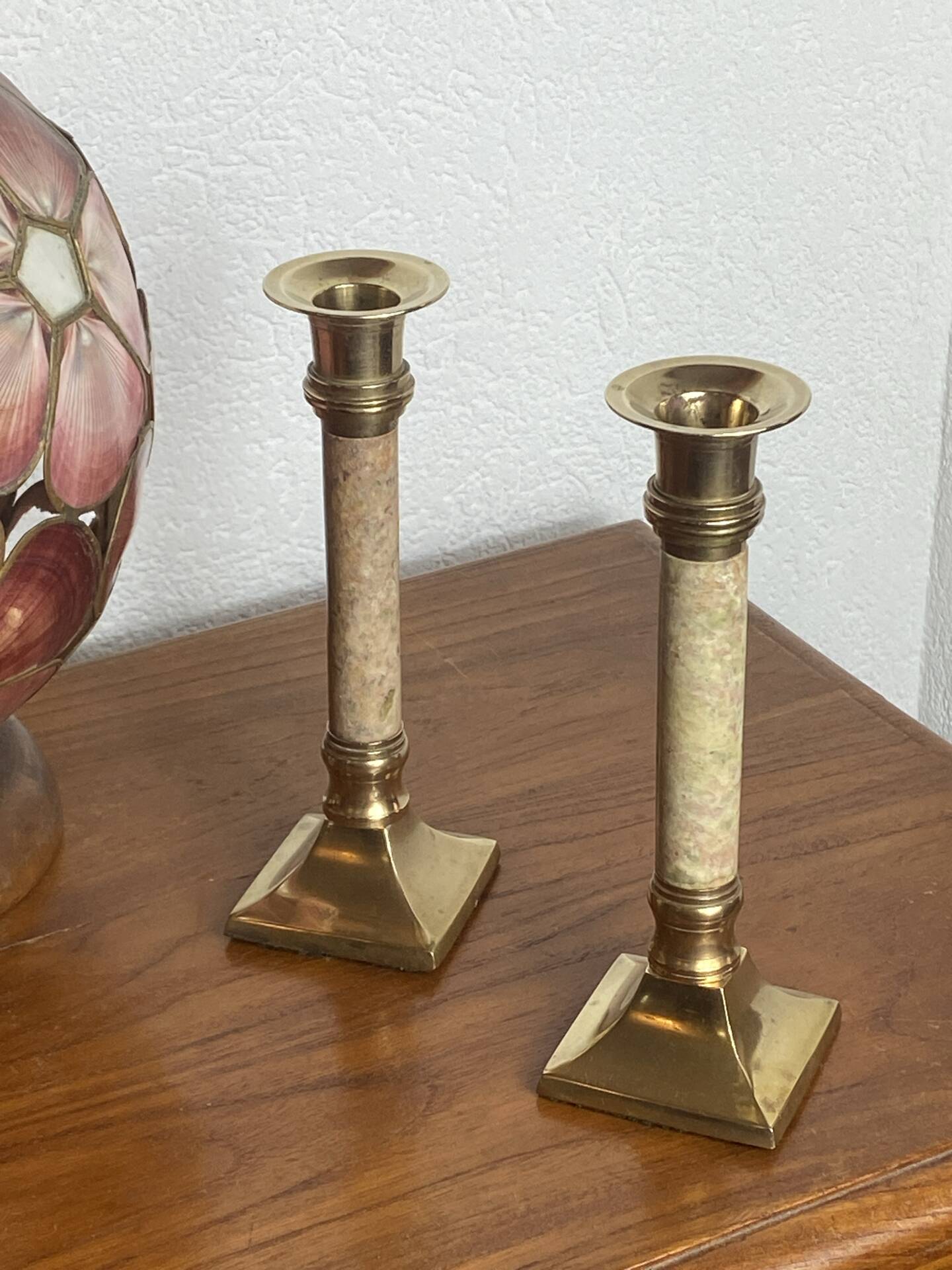 Pair of brass and stone candlesticks