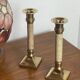 Pair of brass and stone candlesticks