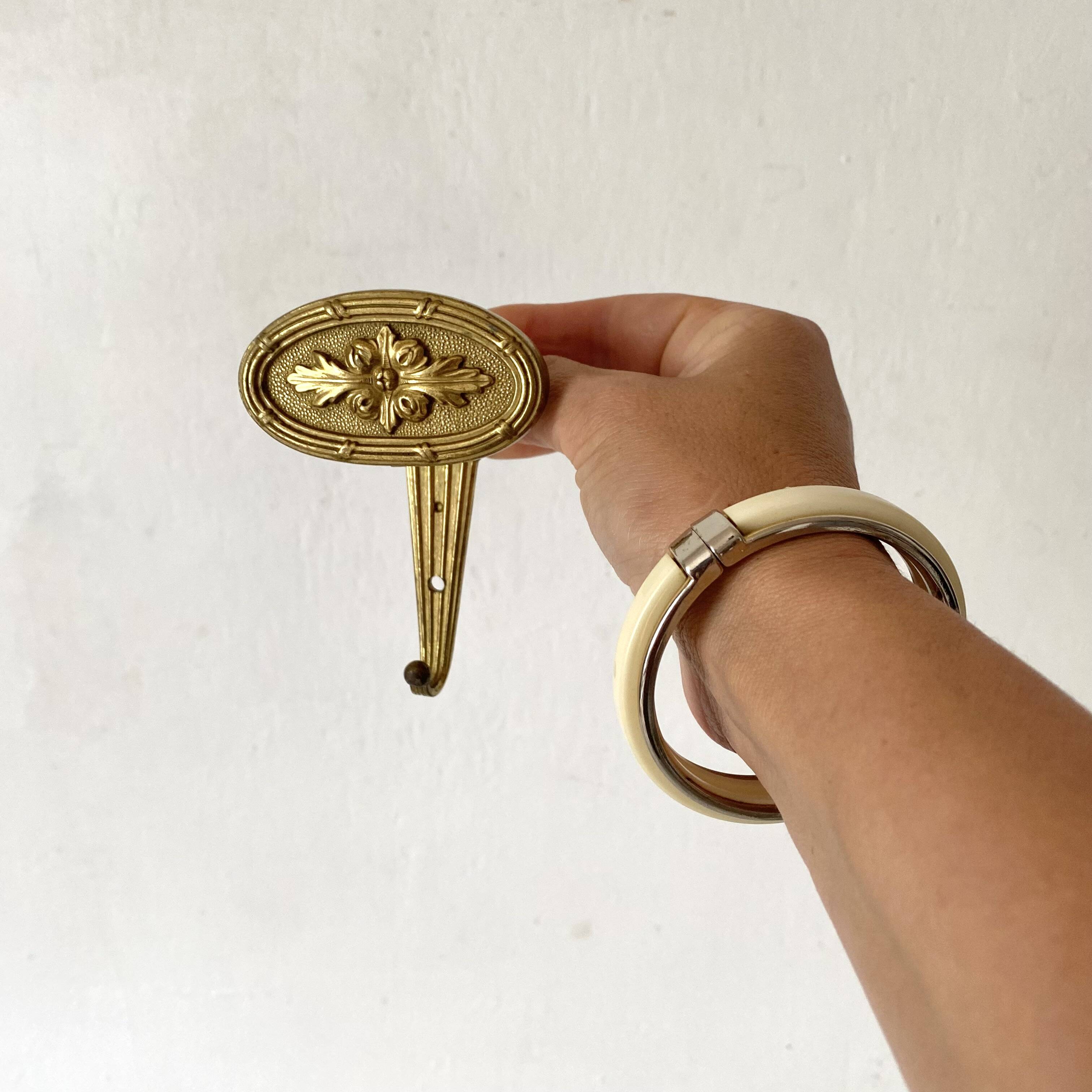 Golden brass coat hook