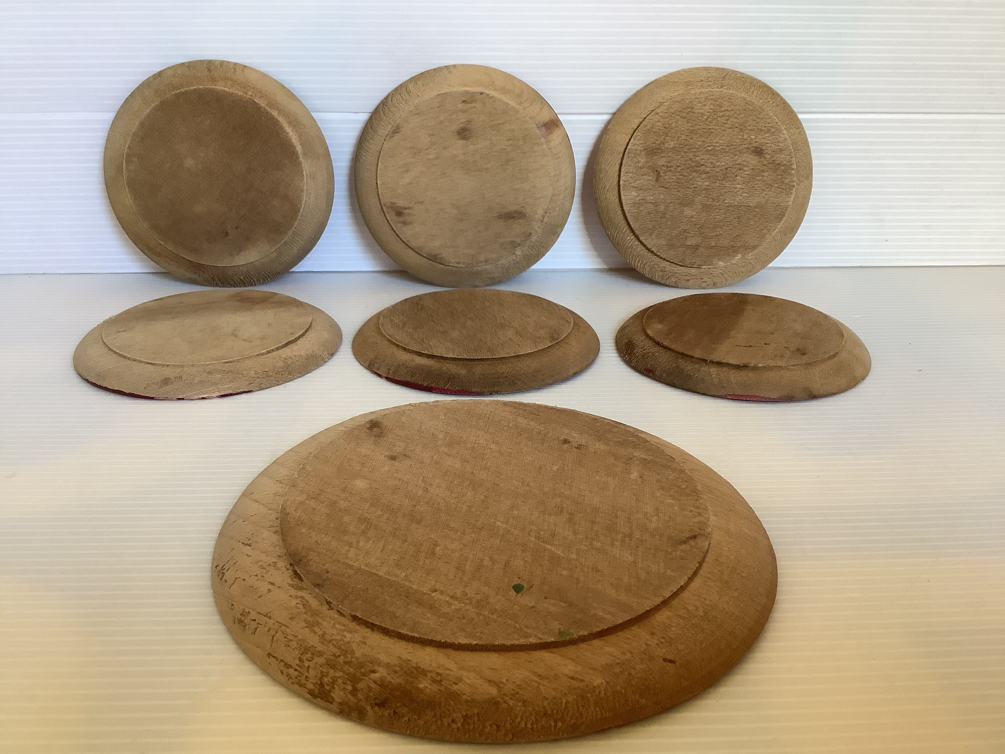 Six coasters of glass wood painted in relief under bottle