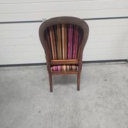 Antique striped multicoloured velvet armchair with turned legs.