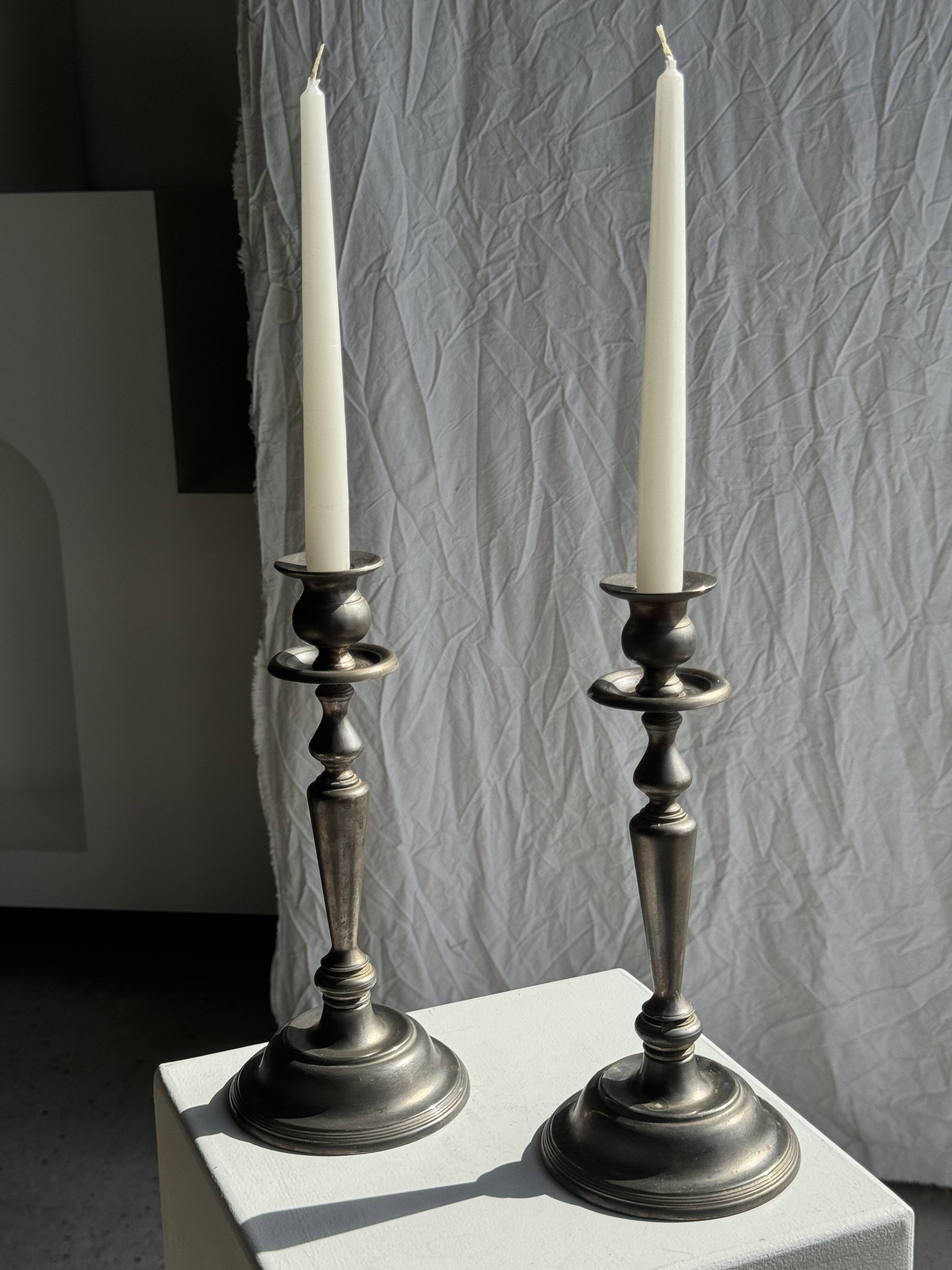 Two large antique silver-plated metal candlesticks, H30