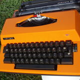 Electric writing machine adler orange and black with its suitcase