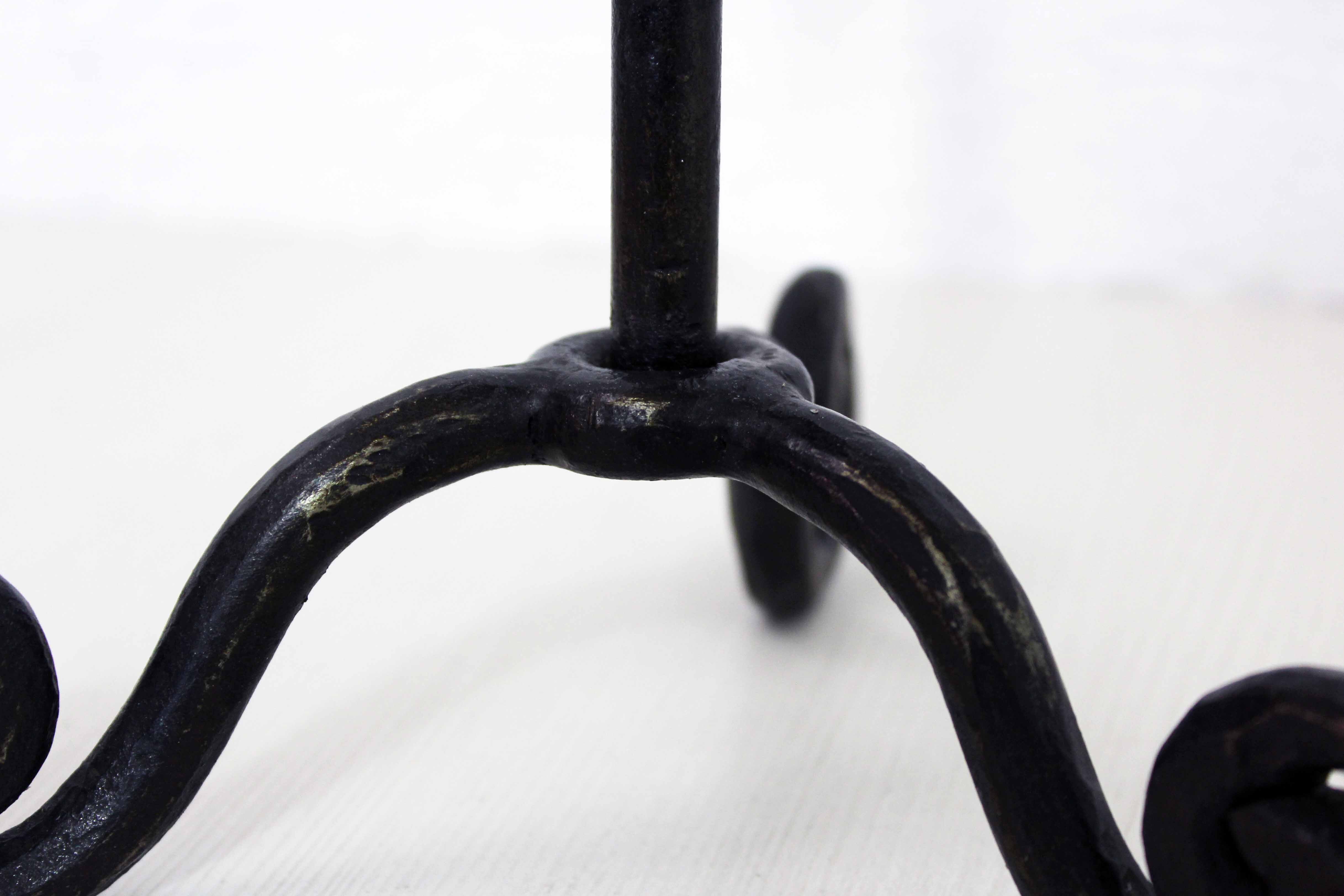 Antique iron candle holder