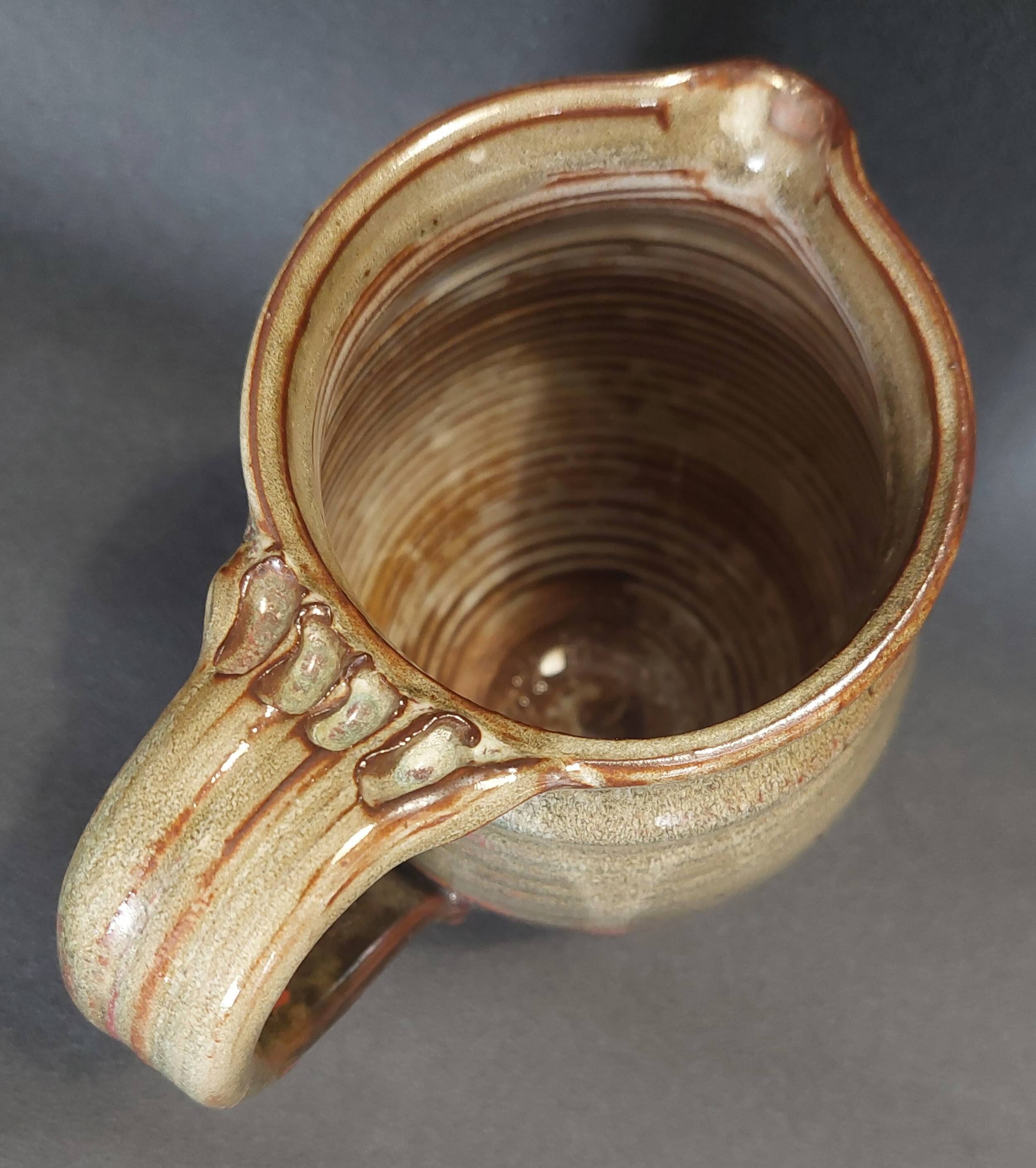 Ceramic pitcher from the 20th century with a signature to identify.