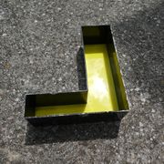 Letter "l" of industrial sign yellow and black