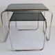 Tubular steel and smoked glass side tables, set of 2