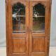 Walnut glazed bookcase with nineteenth century rose window