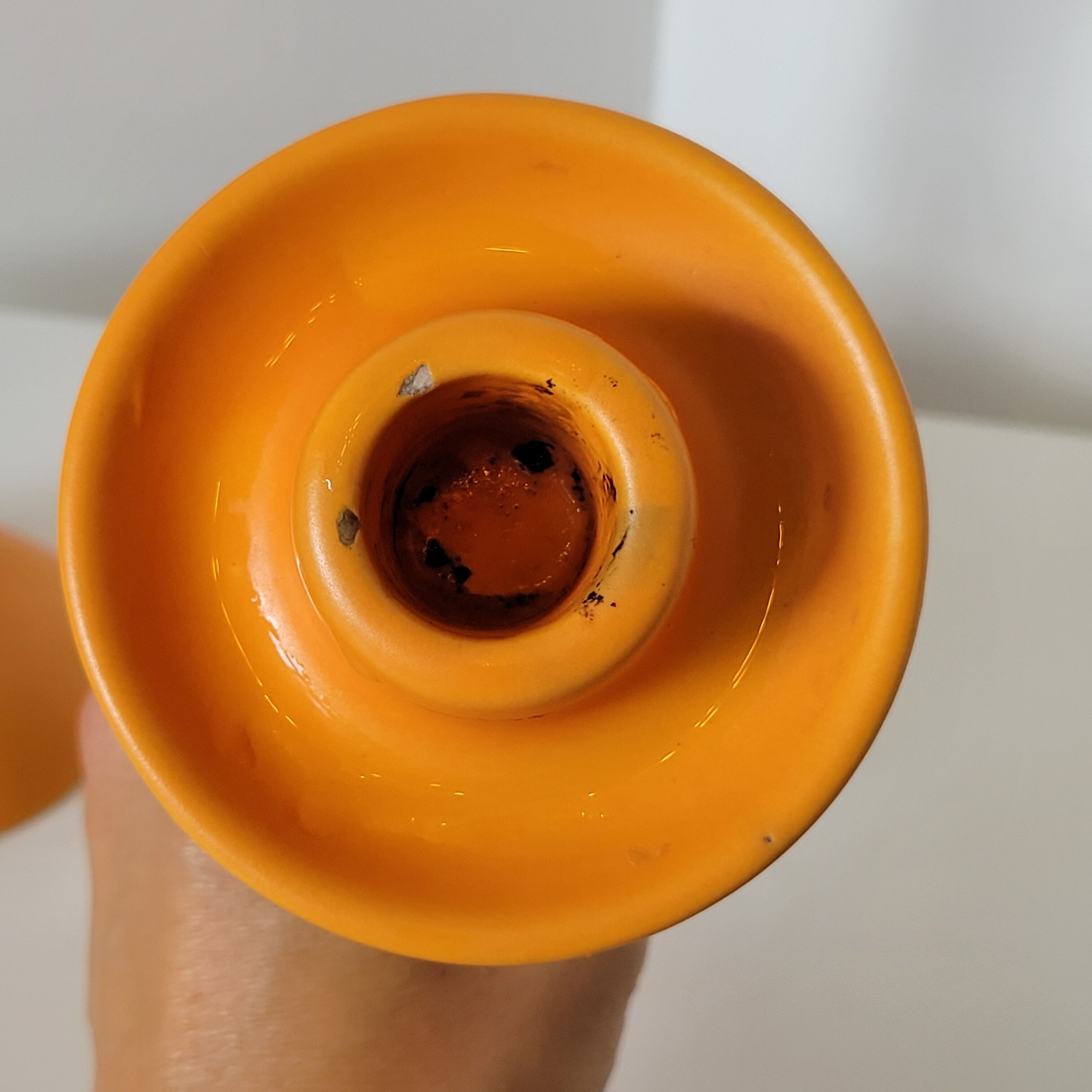 2 orange ceramic candle holders