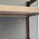 Modular metal wall shelf in brown and beige vintage 70s design.