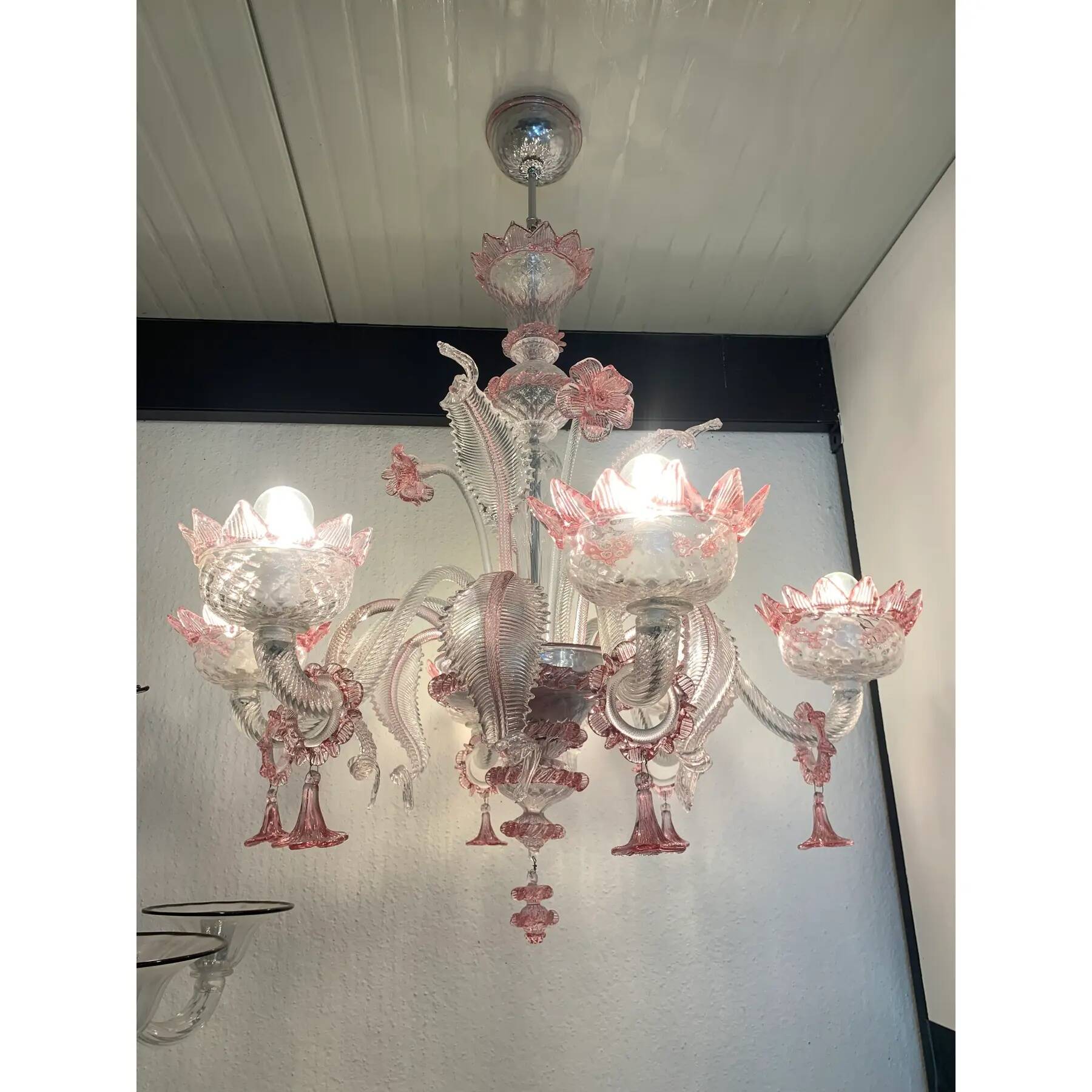 Chandelier in transparent and pink Murano-style glass with flower and leaf.