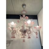 Chandelier in transparent and pink Murano-style glass with flower and leaf.