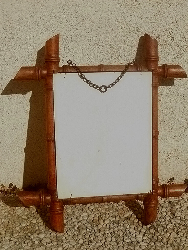Old wooden mirror, carved bamboo way