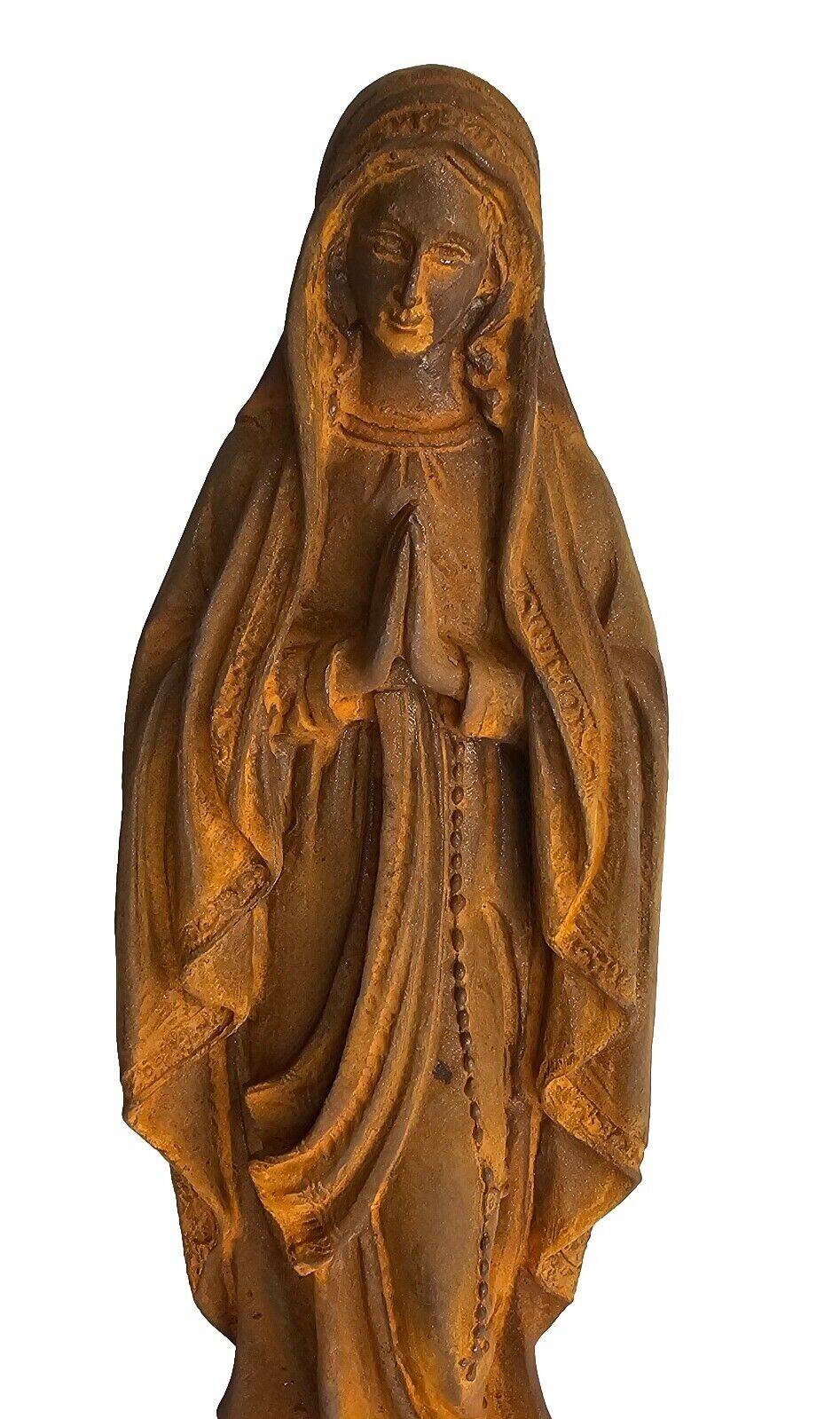 cast iron statue of the virgin