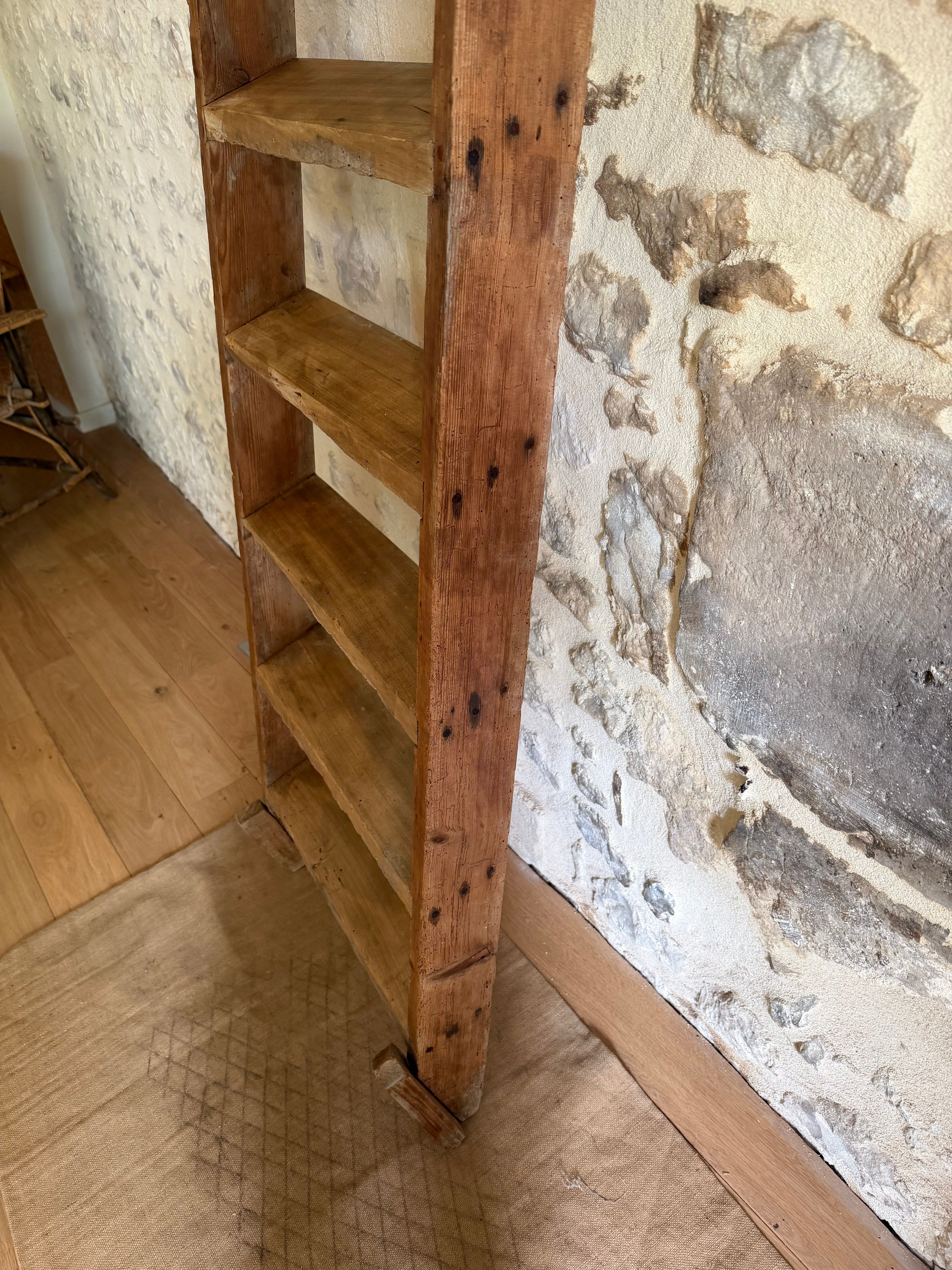 Decorative wooden ladder or towel rack.
