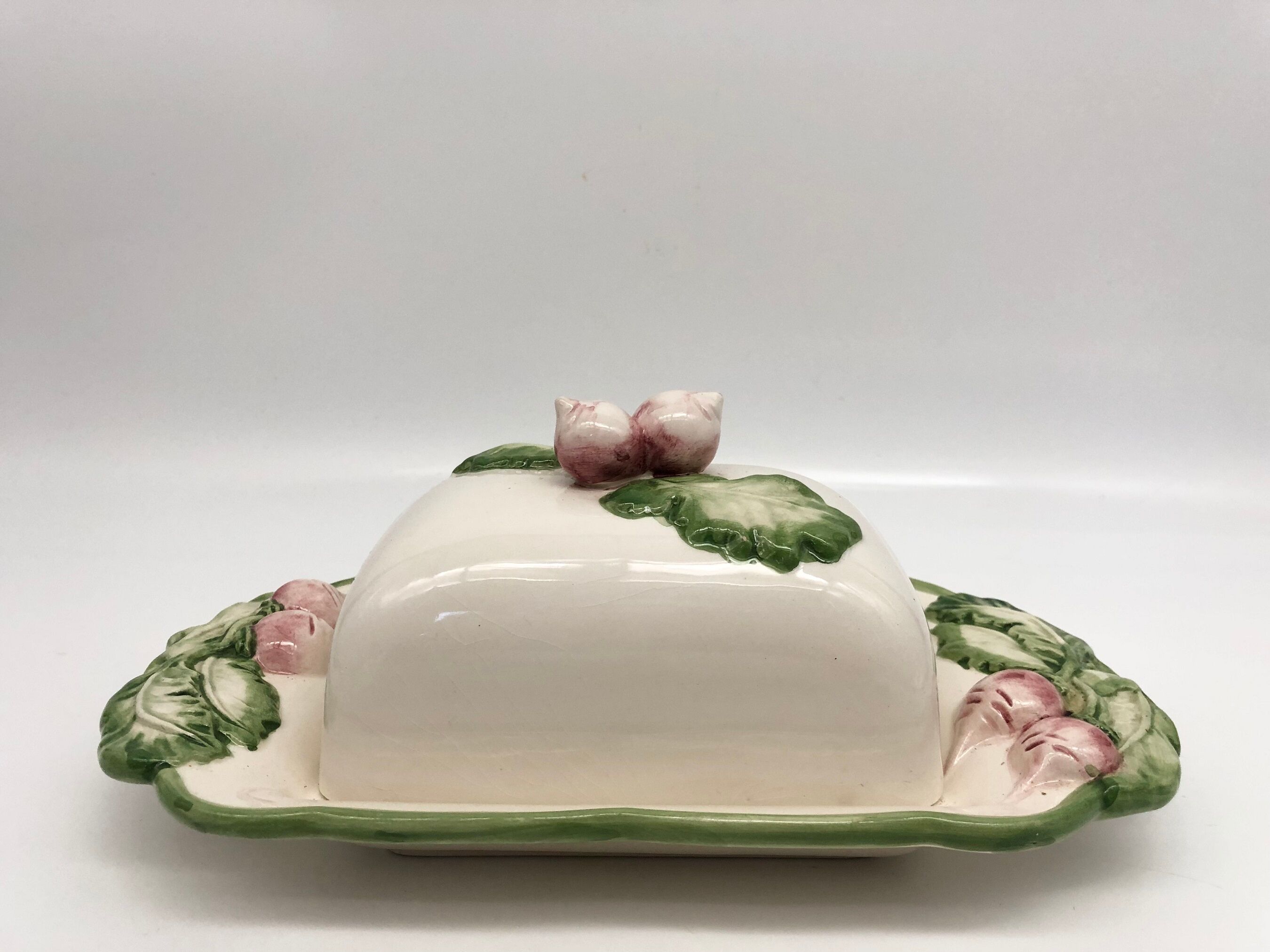 Slurry butter dish, with radish drawings. Signed "FG"